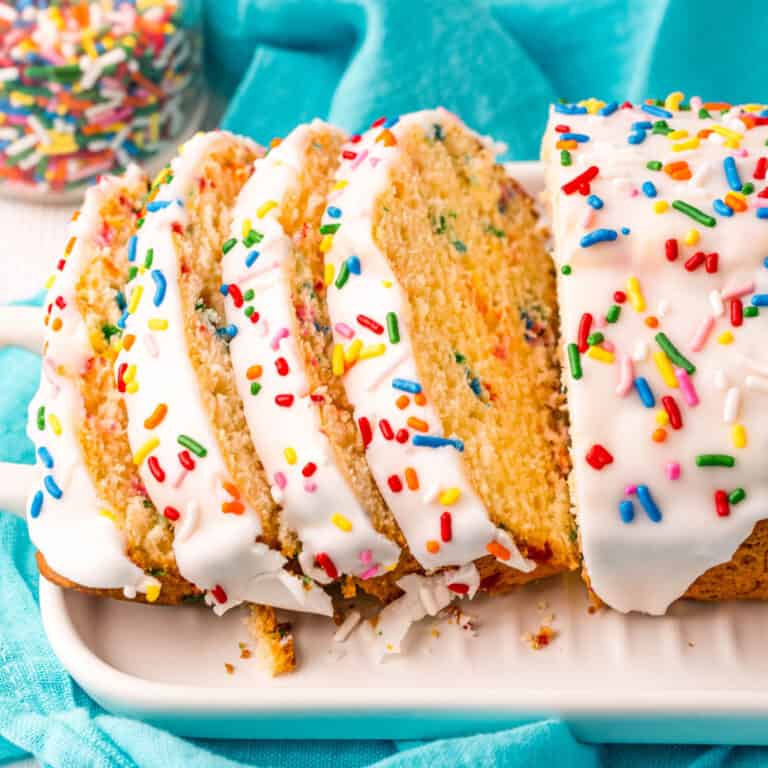 square image of a loaf of ice cream bread with slice cut from one end