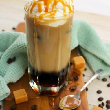 This Iced Caramel Macchiato recipe is the perfect iced coffee drink! Made with just a few simple ingredients, you'll quickly discover that you can make this coffee-house quality drink right at home!