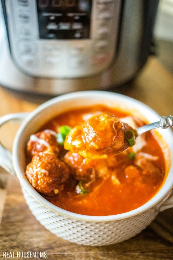 bowl and spoonful of instant pot meatball soup