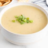 square image of instant pot potato leek soup in a bowl