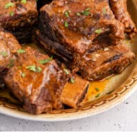 instant pot short ribs in a serving platter with recipe name at the bottom