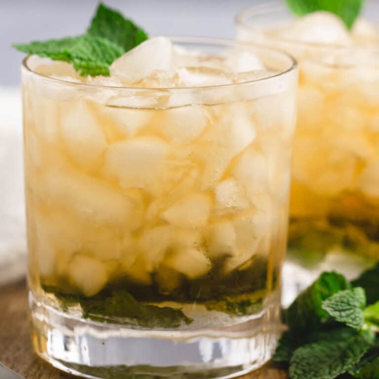 square image of two Irish Juleps next to some fresh mint