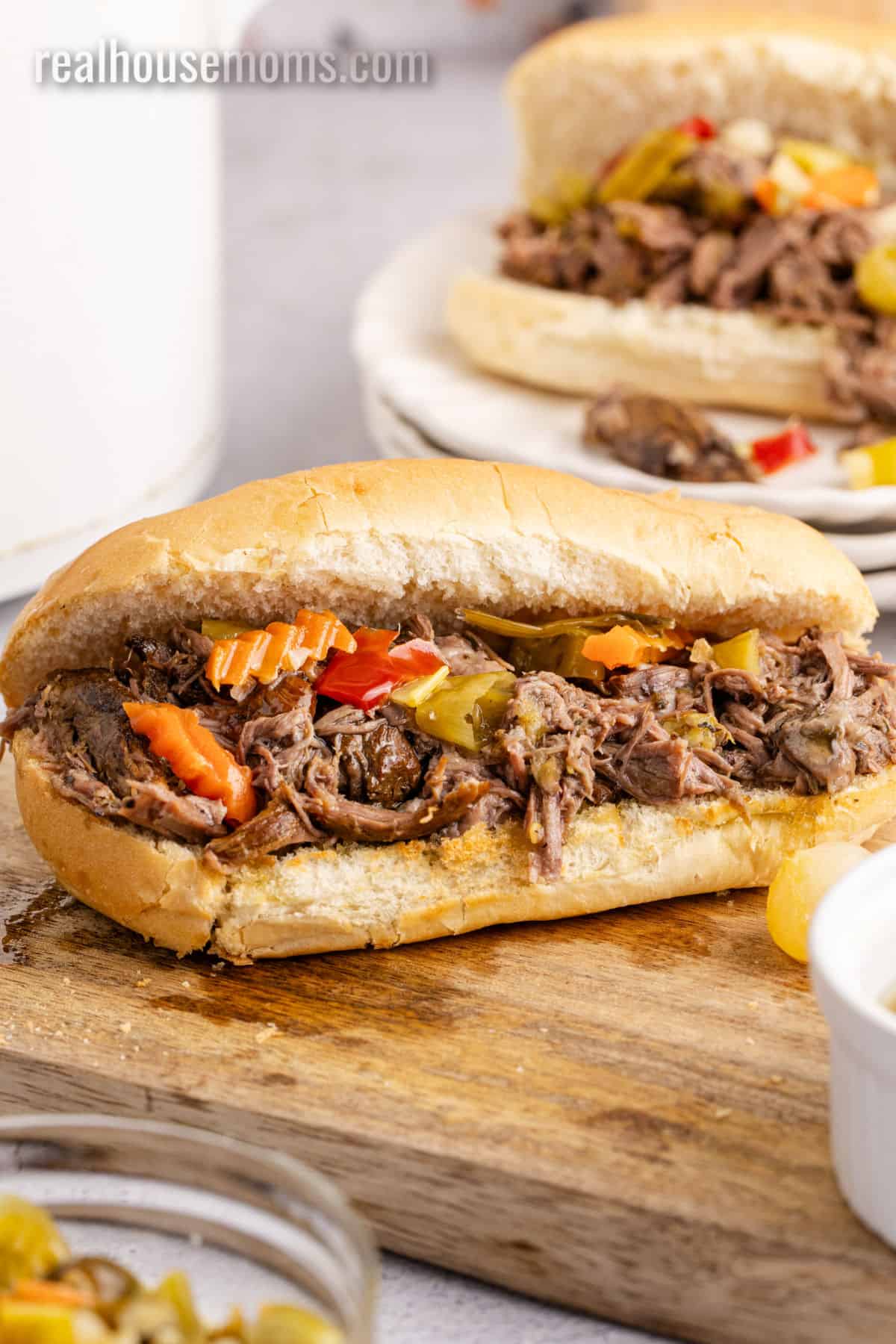 italian beef sandwich with giardiniera on a cutting board