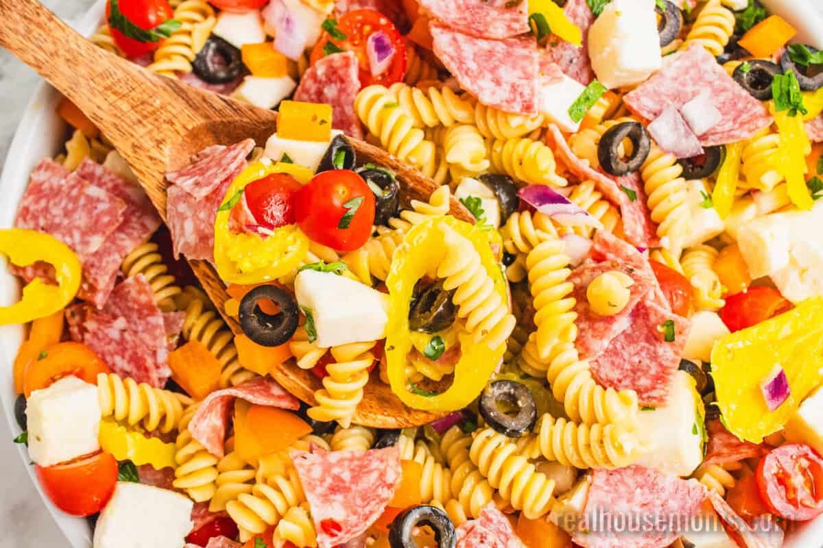 serving spoon in a bowl of italian pasta salad