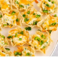 jalapeno popper cups on a serving platter with recipe name at the bottom