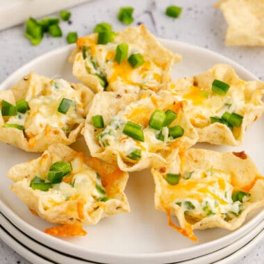 square image of jalapeno popper cups arranged on a small plate