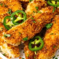 jalapeno ranch chicken tenders on a platter with recipe name at the bottom