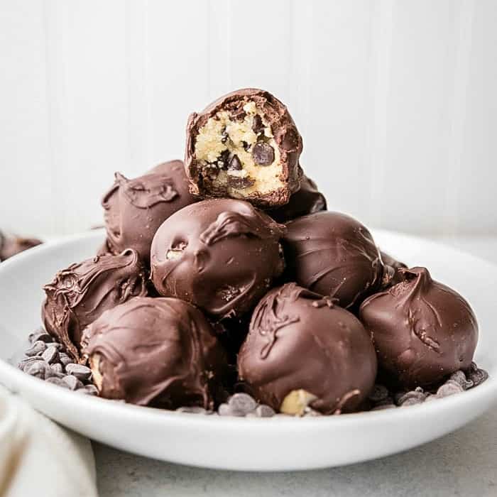 Keto Chocolate Chip Cookie Fat Bombs are a perfect low carb, keto friendly dessert! Dipped in sugar-free chocolate, you'll love indulging in this treat!