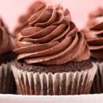square close up image of keto chocolate cupcake on a cake stand