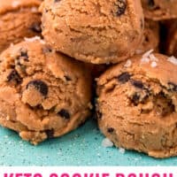 keto cookie dough bites stacked up on a plate with recipe name at the bottom
