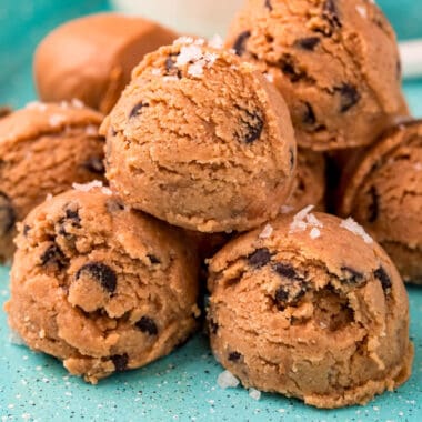 square image of keto cookie dough bites piled up on a tray