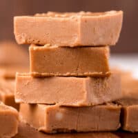 square image of keto peanut butter fudge squares stacked up