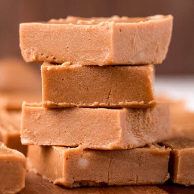 square image of keto peanut butter fudge squares stacked up