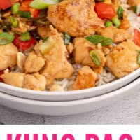 kung pao chicken served over rice with chopsticks with recipe name at the bottom