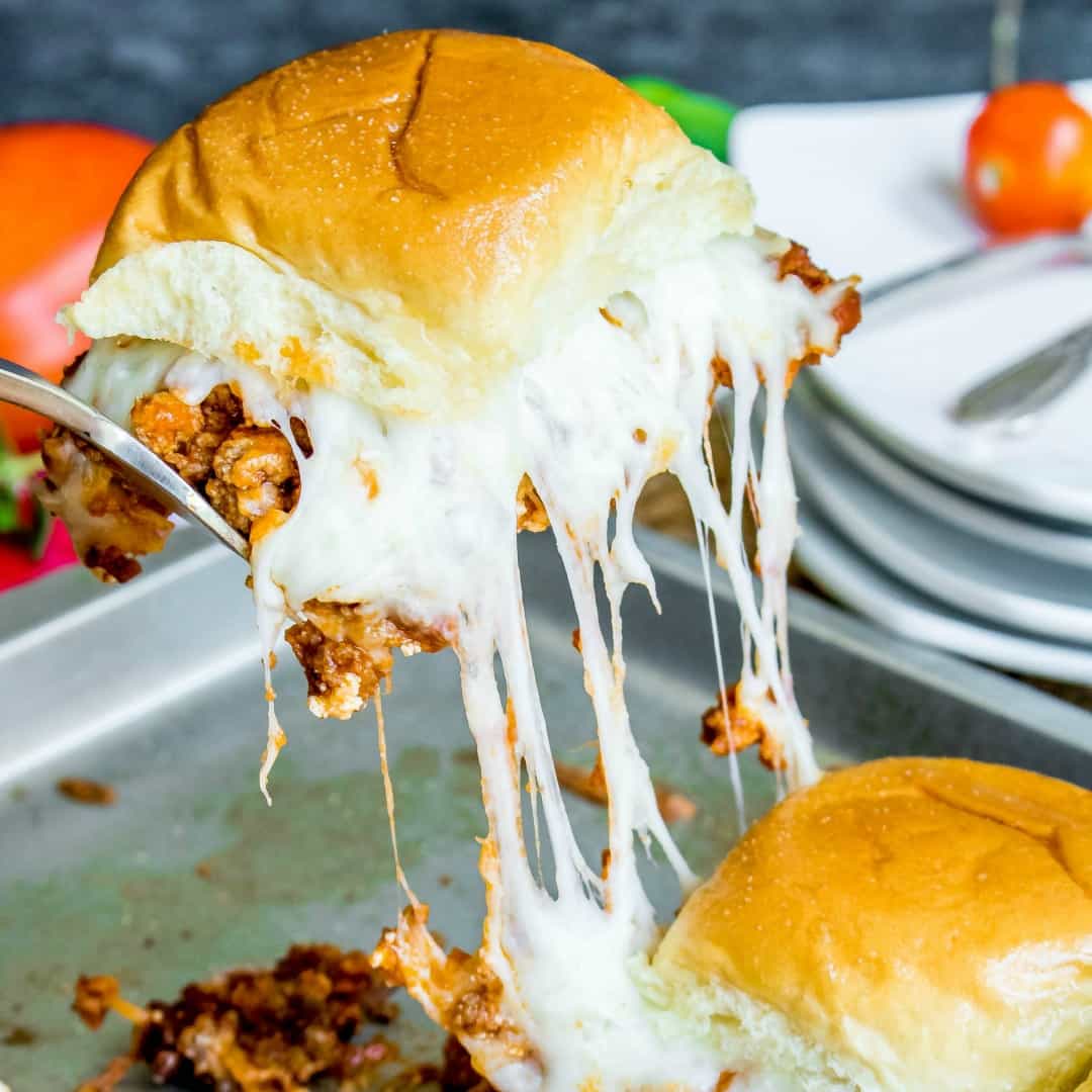 These Lasagna Sliders are bite sized sandwiches filled with all of the flavors of a classic lasagna! They're the perfect bite for your next party!