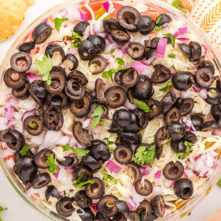 square image of layered ranch dip topped with chopped parsley