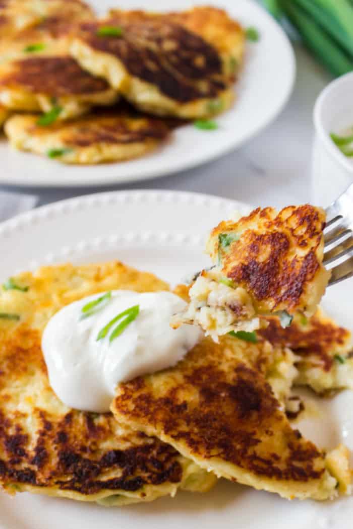 fork with a bite of mashed potato pancake