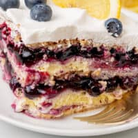 slice of lemon blueberry icebox cake on a plate with recipe name at the bottom