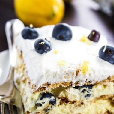 Lemon Blueberry Icebox Cake is a perfect summer dessert. A no bake recipe that's light & refreshing with blueberries and lemon will become a barbecue & potluck must have!