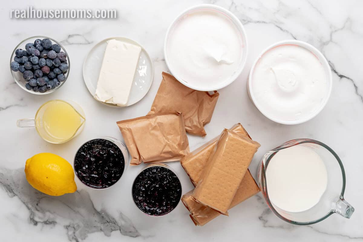 ingredients to make lemon blueberry icebox cake laid out on a counter