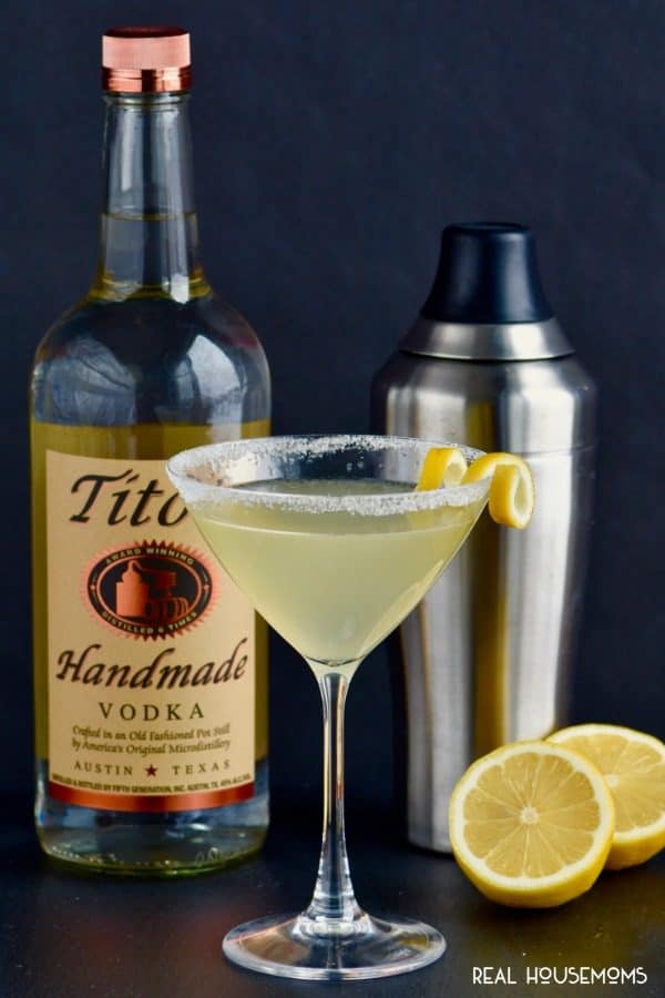 Lemon Drop Martini with vodka bottle, shaker, and lemons