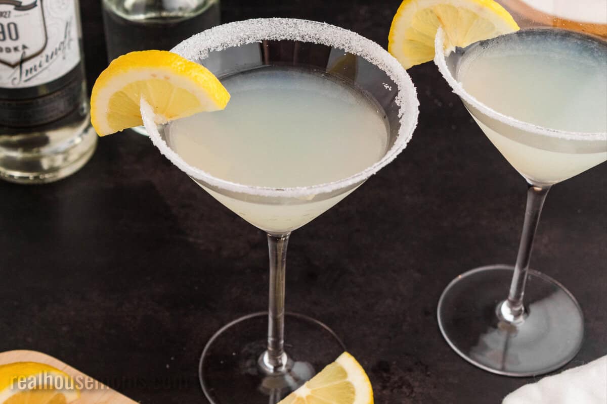 close up of a lemon drop martini with a sugared rim and lemon slice for garnish