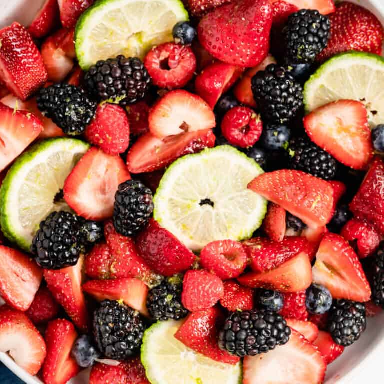 square close up image of lemon lime berry salad
