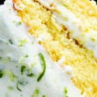 layer cake on a white plate with lime zest