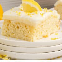 slice of lemon poke cake on a plate with recipe name at the bottom
