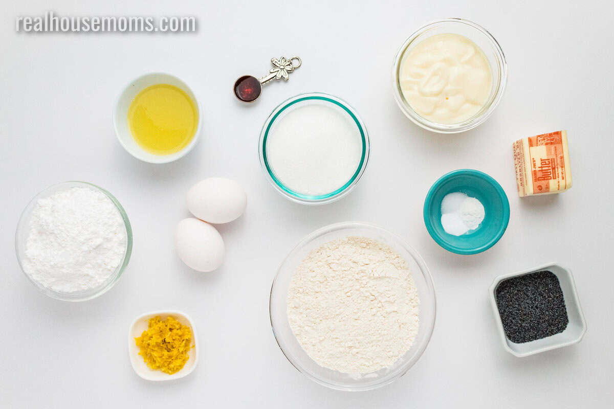 looking down at ingredients to make lemon poppy seed muffins on a counter