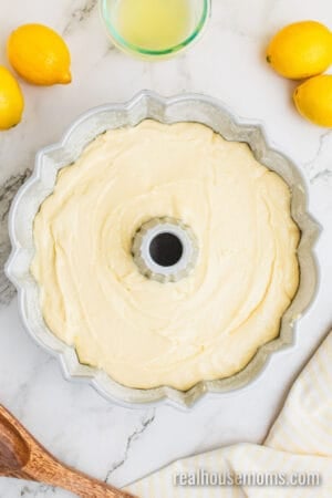 lemon pound cake batter in a greased and floured bundt cake pan
