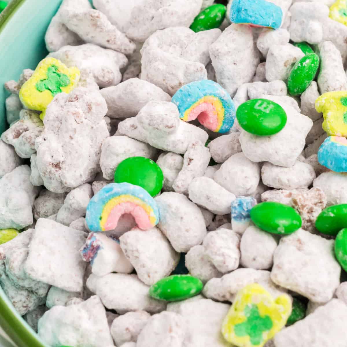 square iamge close up of Leprechaun Snack Mix with lucky charms marshmallows and green M&Ms