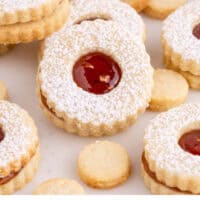 linzer cookies arranged on a tray with recipe name at the bottom