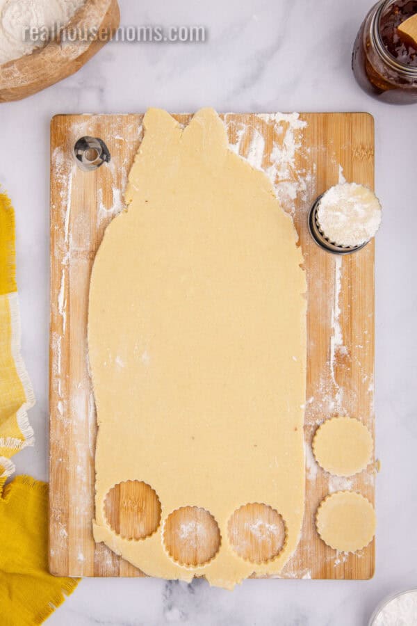 big linzer cookie cutter cutting out rolled out cookie dough