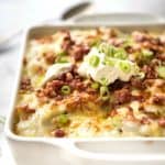 These aren't your typical mashed potatoes. This Loaded Mashed Potato Casserole is packed with BACON and CHEESE! It's creamy, salty, cheesy, and it tastes so good!