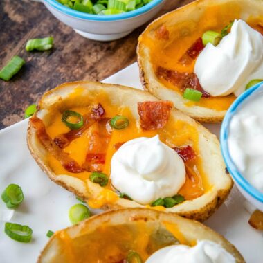 Learn how to make the best crispy Loaded Potato Skins! Quick and easy for a crowd-pleasing appetizer or a comforting side dish!