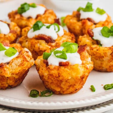 square image of loaded tater tot bites on a serving plate