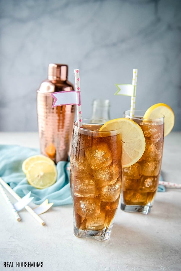 long island iced tea with a cocktail shaker and lemon