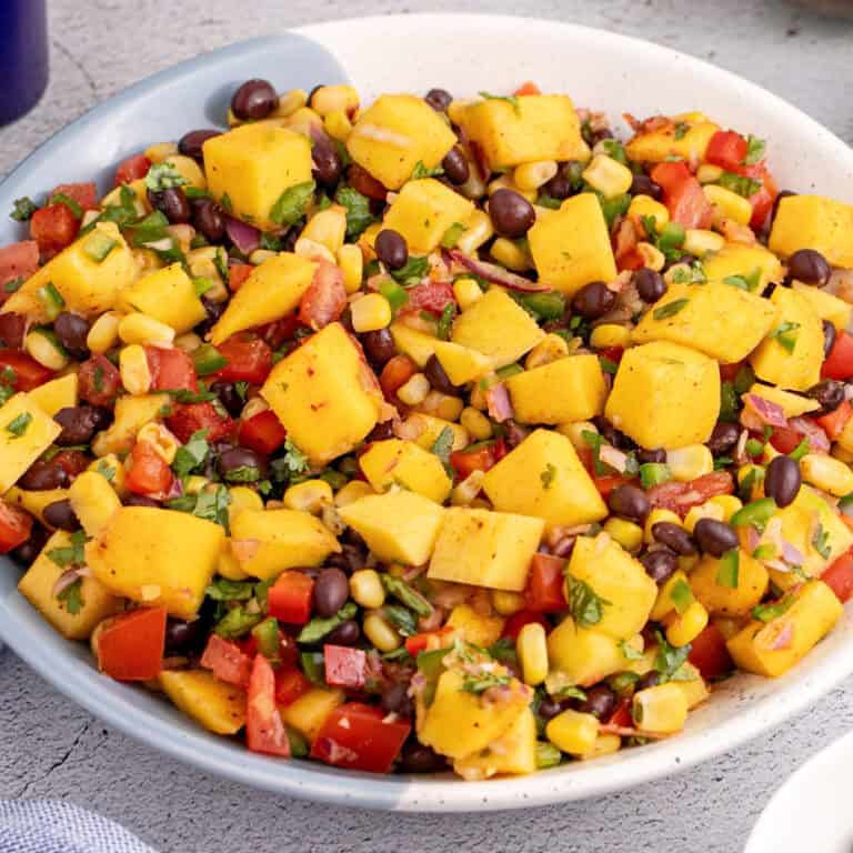 square image of a bowl of mango black bean salsa