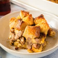 portion of maple sausage french toast bake on a plate with recipe name at the bottom