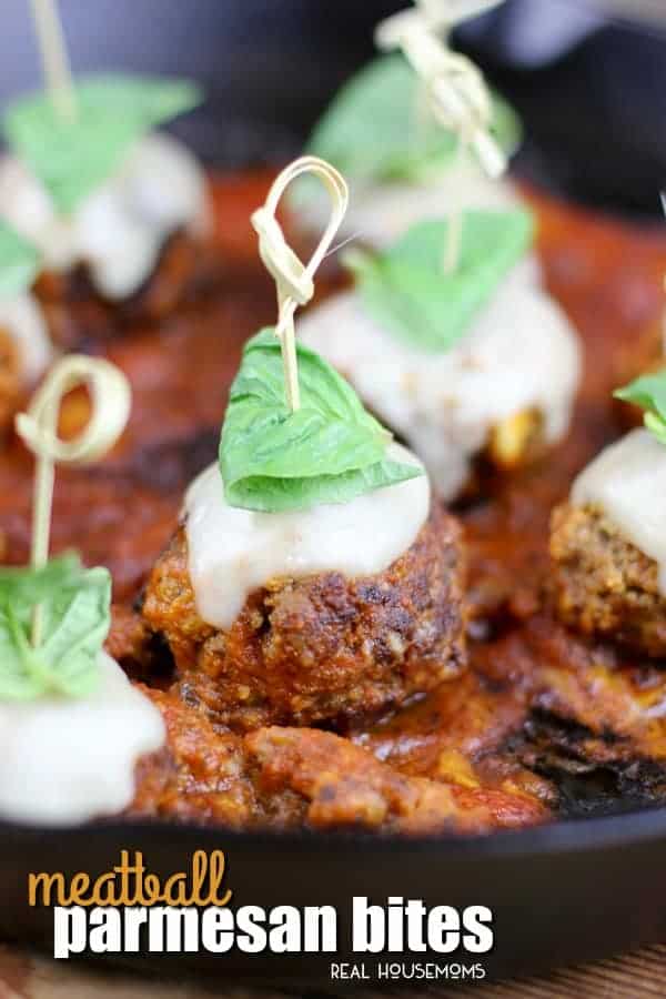 Meatball Parmesan Bites are the perfect appetizer for your next get together.  Tender meatballs, infused with garlic, breadcrumbs, and parmesan are smothered in red sauce and topped with mozzarella & basil for a burst of Italian flavor!