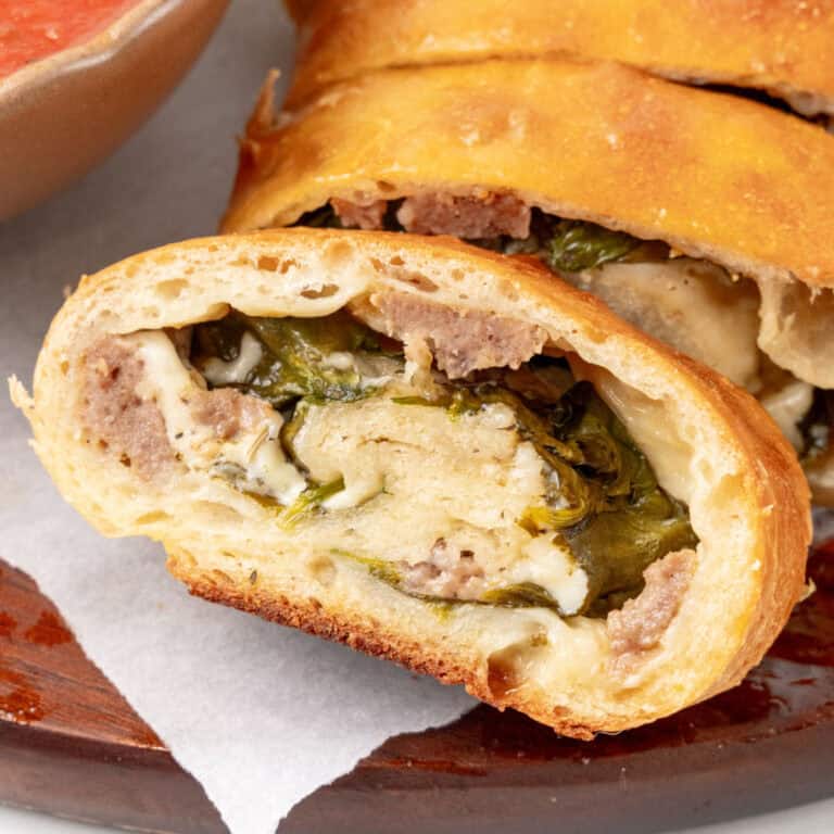 square image of a meatball pizza bread slice