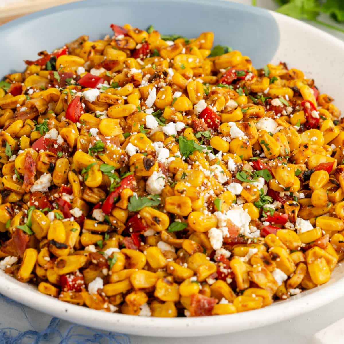 square image of mexican blackened corn in a serving bowl
