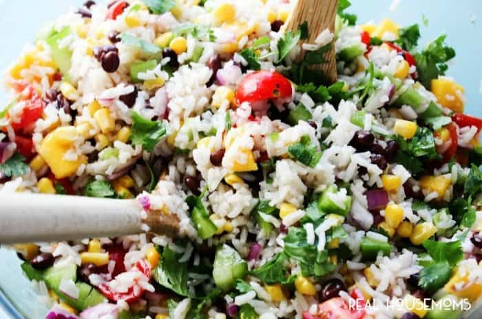 MEXICAN MANGO RICE SALAD is a fresh summer dish loaded with fresh veggies, mangoes then drizzled with a cumin vinaigrette. Easy, delicious and ready in 25-minutes!
