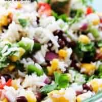 MEXICAN MANGO RICE SALAD is a fresh summer dish loaded with fresh veggies, mangoes then drizzled with a cumin vinaigrette. Easy, delicious and ready in 25-minutes!