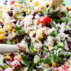 MEXICAN MANGO RICE SALAD is a fresh summer dish loaded with fresh veggies, mangoes then drizzled with a cumin vinaigrette. Easy, delicious and ready in 25-minutes!