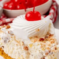 image of a slice of million dollar pie on a small white plate with the title of the post on the top of the image in black and blue lettering