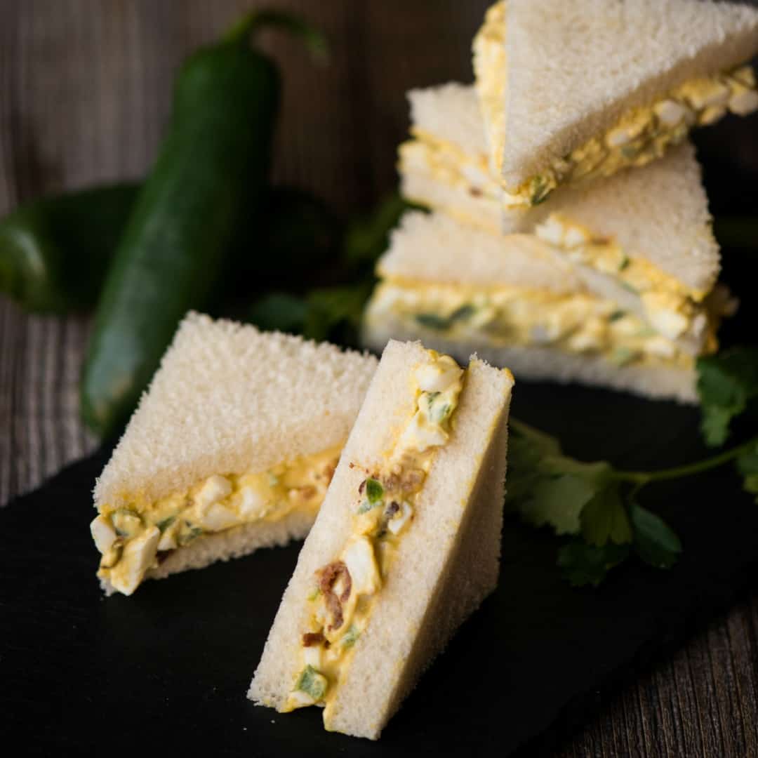 Whether you're preparing a fancy afternoon tea or a game day feast, Mini Bacon Jalapeno Egg Salad Sandwiches are sure to please!