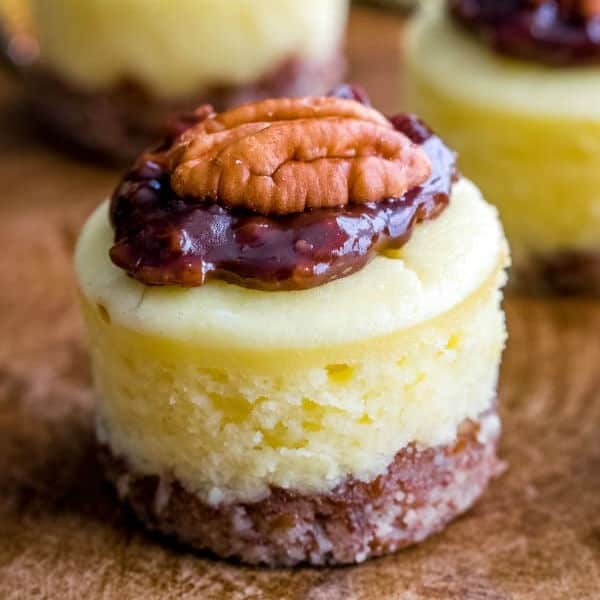 square image on a mini chocolate pecan pie cheesecake on a cutting board