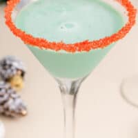 image of chocolate mint martini in martini glasses with red sugared rims with the title of the post on top of the image in blue and black lettering